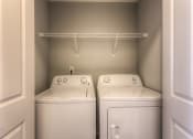 Thumbnail 77 of 78 - a washer and dryer in the laundry room of a house  at EdgeWater at City Center, Lenexa, KS