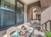 Thumbnail 78 of 78 - a patio with two chairs and a table  at EdgeWater at City Center, Lenexa, 66219