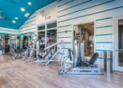 Thumbnail 47 of 78 - a gym with a variety of exercise equipment  at EdgeWater at City Center, Lenexa, Kansas