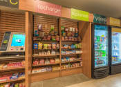 Thumbnail 49 of 78 - a refrigerated section of the store with a vending machine next to it  at EdgeWater at City Center, Kansas, 66219