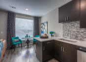 Thumbnail 59 of 78 - kitchen cabinets with dining table and chairs  at EdgeWater at City Center, Lenexa, 66219