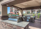 Thumbnail 7 of 78 - an outdoor grill area with two bbq grills  at EdgeWater at City Center, Lenexa, 66219