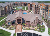 Thumbnail 24 of 78 - an aerial view of a large complex with a pool and landscaping  at EdgeWater at City Center, Lenexa, KS, 66219