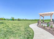 Thumbnail 53 of 78 - take a stroll in our dog park with bench seat  at EdgeWater at City Center, Lenexa, KS