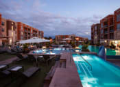 Thumbnail 14 of 84 - Royale pool and spa at dusk at The Royale at CityPlace, Overland Park, KS