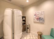 Thumbnail 32 of 53 - tanning room with a chair and a stand up tanning machine  at Waterside Residences on Quivira, Kansas, 66215
