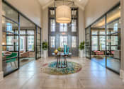 Thumbnail 13 of 53 - clubhouse entrance with access to the leasing office and the mailroom  at Waterside Residences on Quivira, Lenexa