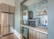 Thumbnail 24 of 53 - community coffee bar with a sparkling water machine  at Waterside Residences on Quivira, Kansas