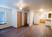 Thumbnail 6 of 15 - Wood Floor Living Room at Lorence Court Apartments, Portland, OR, 97216