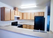 Thumbnail 11 of 13 - Fully Equipped Kitchen at Alder Crossing Apartments, Portland, OR, 97233
