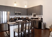 Thumbnail 11 of 16 - stainless steel. Every kitchen has a large island! at Epic Apartments, Denton, Texas