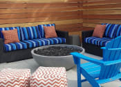 Thumbnail 14 of 36 - Outdoor fire pit with seating at Mission Trails Apartments San Diego, California, 92119