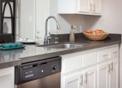 Thumbnail 10 of 36 - Kitchen with stainless steel appliances at Mission Trails Apartments San Diego, San Diego, CA, 92119