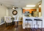 Thumbnail 24 of 36 - Kitchen and dining area at Mission Trails Apartments San Diego, San Diego