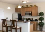 Thumbnail 3 of 28 - Kitchen with Island at Long Pond Shores Waterfront Apartments, Rochester, NY