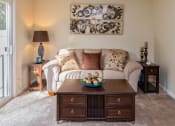 Thumbnail 8 of 18 - Bright Living Room at Collett Woods Townhouses, Farmington, NY