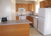Thumbnail 7 of 22 - Kitchen with Island at Stone Hedge Village Townhouses, Farmington, NY
