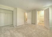 Thumbnail 22 of 24 - Master Bedroom and Bathroom at Fetzner Square Apartments & Townhouses, Rochester, NY