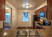 Thumbnail 2 of 11 - Kitchen with Electric Appliances at Georgetown Apartments, Williamsville, NY