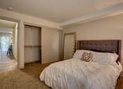 Thumbnail 23 of 50 - Bedroom with lamp and window at Commons at Redwood Creek Apartments, Oregon, 97008