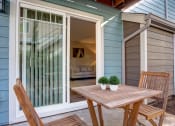 Thumbnail 30 of 50 - Chair and table at Commons at Redwood Creek Apartments, Beaverton, 97008
