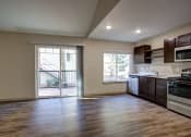 Thumbnail 27 of 50 - Living and kitchen area at Commons at Redwood Creek Apartments, Oregon