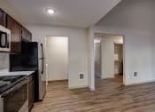 Thumbnail 28 of 50 - Kitchen with appliances at Commons at Redwood Creek Apartments, Beaverton, OR, 97008
