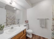 Thumbnail 14 of 27 - full bathroom with large mirror and under the sink storage 