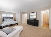 Thumbnail 12 of 27 - large primary bedroom with attached bathroom 