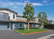 Thumbnail 2 of 15 - Front View of Units with Single Attached Garage. Two Story Townhome