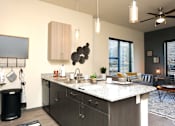 Thumbnail 4 of 11 - Kitchen And Living at The Liberty Lofts, Gainesville, TX, 76240