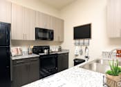 Thumbnail 3 of 11 - Black Appliances at The Liberty Lofts, Texas, 76240