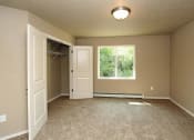 Thumbnail 10 of 12 - Bedroom with Closet and Window
