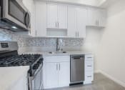 Thumbnail 14 of 18 - Fully Equipped Kitchen Includes Frost-Free Refrigerator, Electric Range, & Dishwasher at Hollywood Vista, Hollywood, California