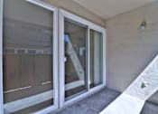 Thumbnail 24 of 28 - A white sliding door with a glass window is open.