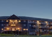 Thumbnail 23 of 80 - Night Exterior View of Bluffs of Williston Apartments ND