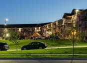 Thumbnail 20 of 80 - Night Exterior View of Bluffs of Williston Apartments ND
