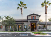 Thumbnail 54 of 55 - a building with two palm trees in front of it