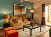Thumbnail 23 of 55 - a living room with green walls and a brown couch