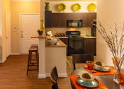 Thumbnail 30 of 55 - a kitchen and dining area in a 555 waverly unit