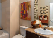 Thumbnail 35 of 55 - a bathroom with a sink toilet and bathtub