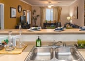Thumbnail 28 of 55 - a kitchen with a sink and a counter top