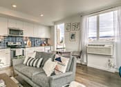 Thumbnail 6 of 40 - Living Room Come Kitchen View at The Fowler, Boise, ID, 83702
