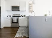 Thumbnail 35 of 40 - White interior kitchen at The Fowler Apartments, Boise