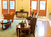 Thumbnail 1 of 9 - Bright and welcoming community room at Park View at Randallstown with seating for resident activities, social gatherings, and events.