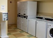 Thumbnail 7 of 9 - On-site laundry facility at Park View at Randallstown with multiple washers and dryers, providing convenient and accessible laundry options for senior residents.