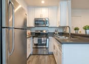 Thumbnail 8 of 19 - Kitchen with new counters and appliances
