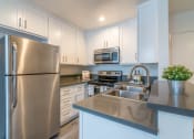 Thumbnail 9 of 19 - Kitchen with new counters and appliances
