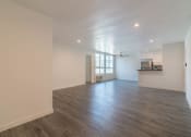 Thumbnail 15 of 19 - Dining area with kitchen and large window view