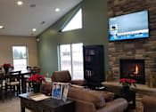Thumbnail 5 of 19 - Clubhouse with Fireplace and TV at Regency Preserve, Avon, IN, 46123